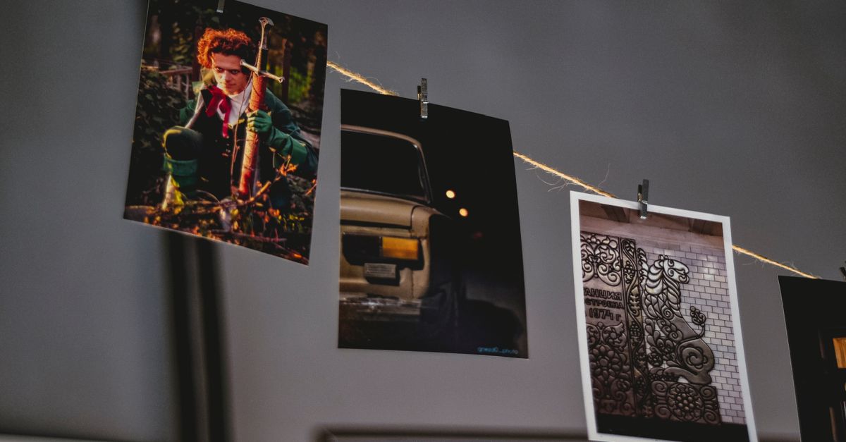 Prints hanging on a string to dry